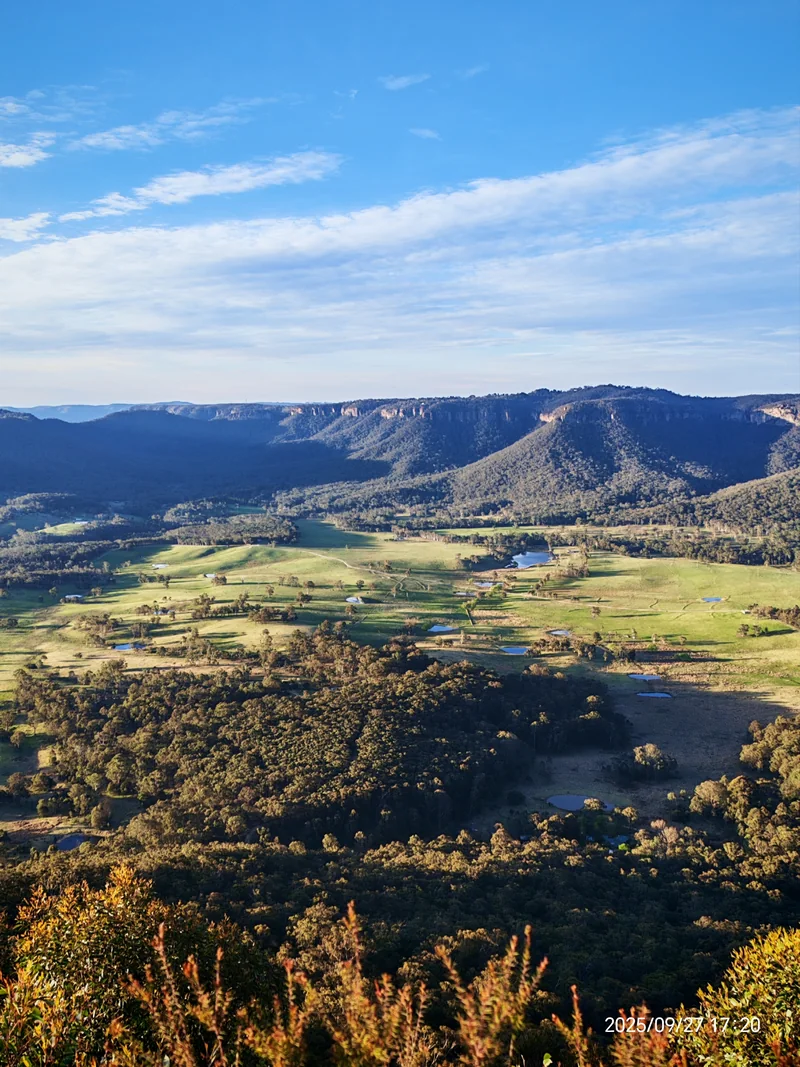 Megalong Valley farmland opening below the sandstone escarpment